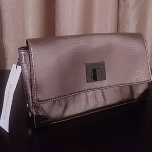 BCBG metallic rose gold clutch